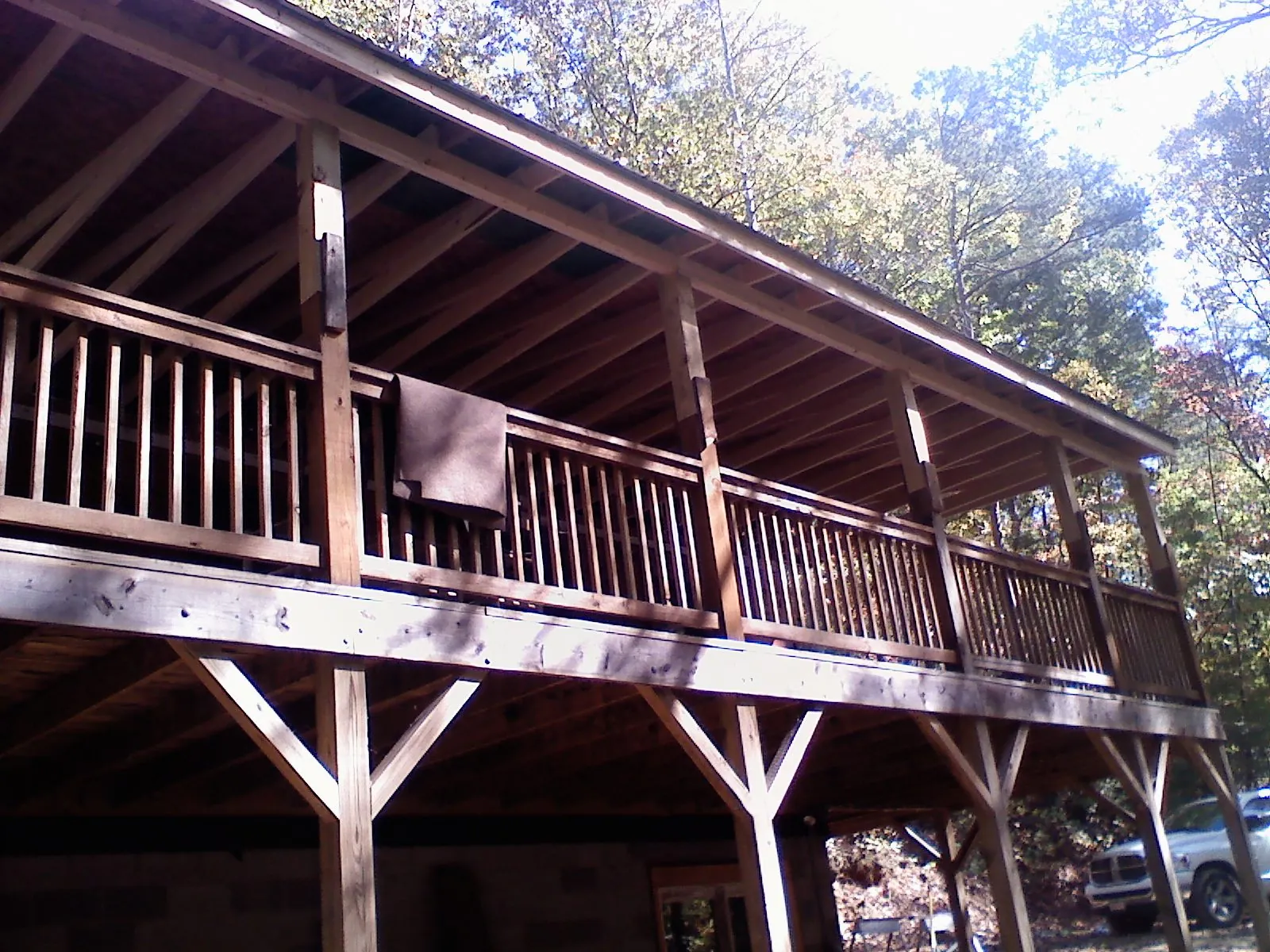 Timber framing under a new elevated porch and deck — Roof Leak Repair in Ford by Roofing Brothers